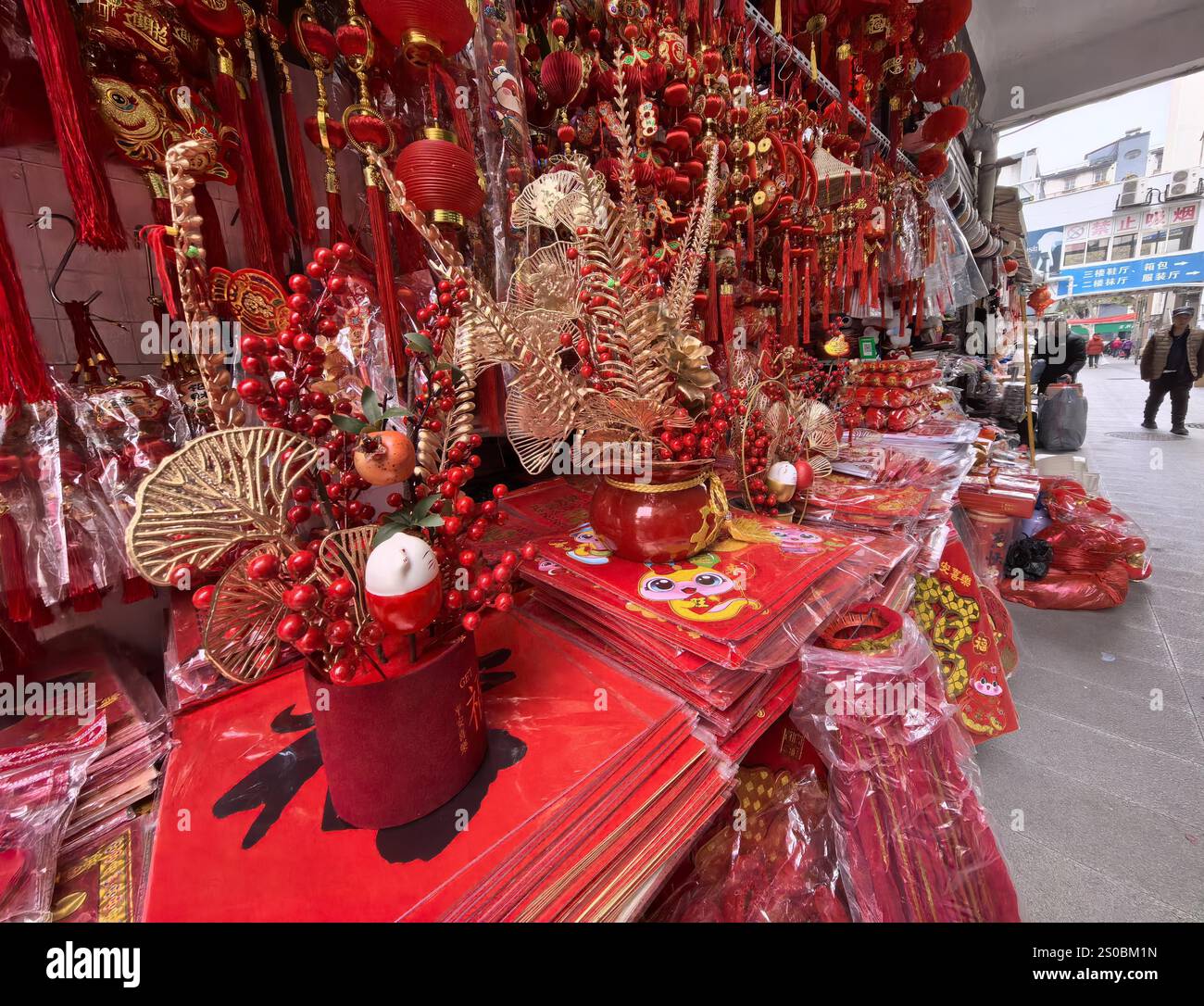 People shop Spring Festival goods at a market in Nanjing City, east