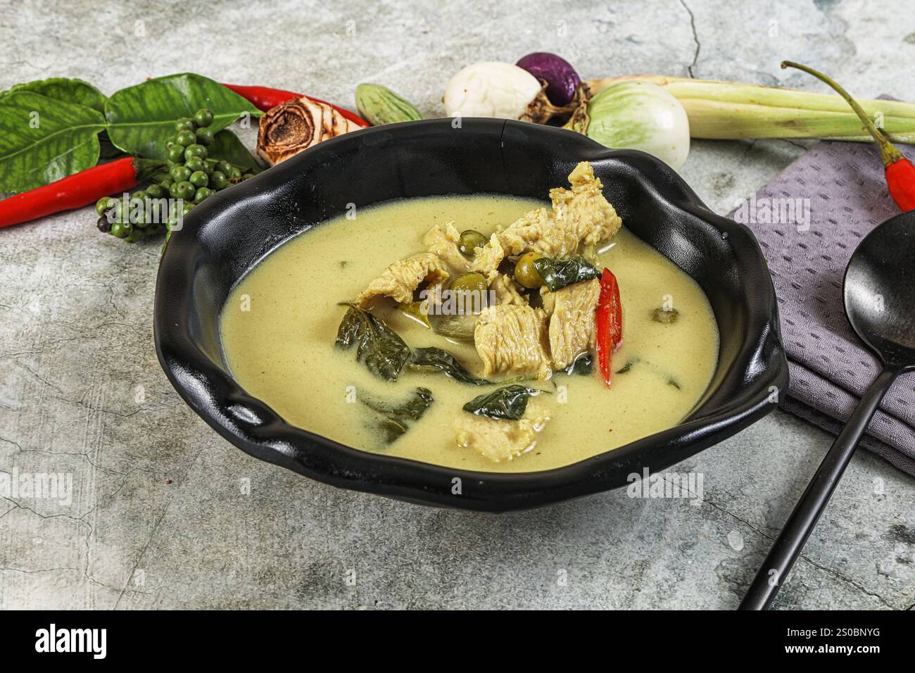 Thai green chicken curry with coconut milk and basil Stock Photo - Alamy