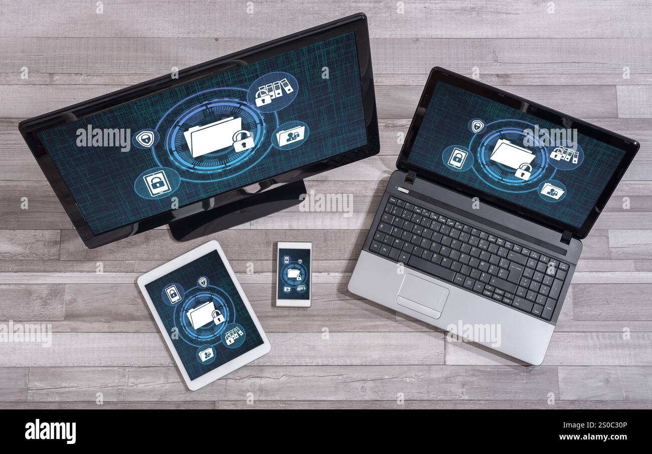 Confidential data concept shown on different information technology devices Stock Photo