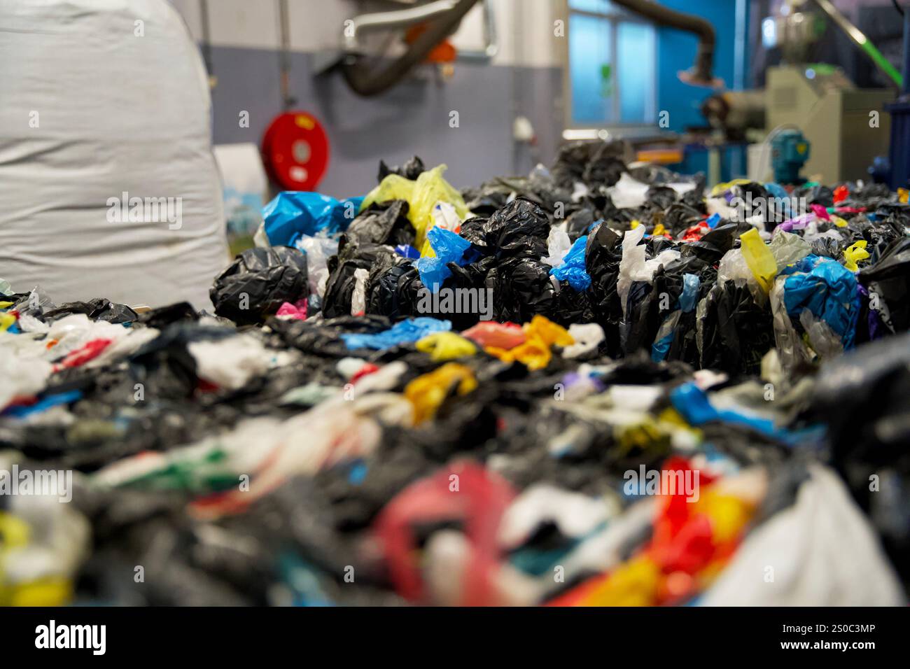 Stack of plastic residual mix waste in a plastic recycling factory ...