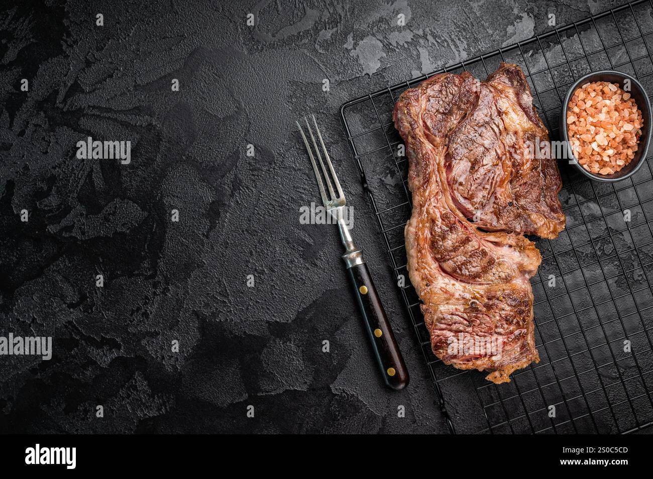 BBQ grilled Chuck eye roll steak, prime beef meat on a steel rack ...