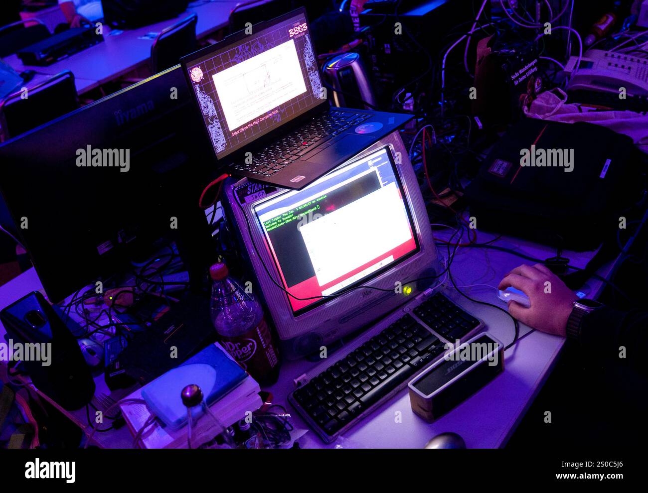 Hamburg, Germany. 27th Dec, 2024. An "iMac G3" (below) stands on a ...