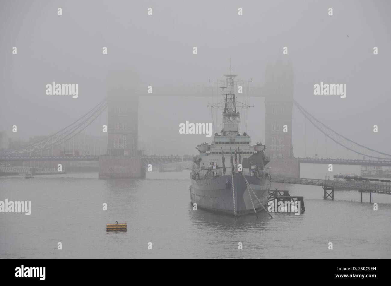 London, UK. 27th December 2024. A view of Tower Bridge and HMS Belfast as fog descends on the capital. Credit: Vuk Valcic/Alamy Live News Stock Photo