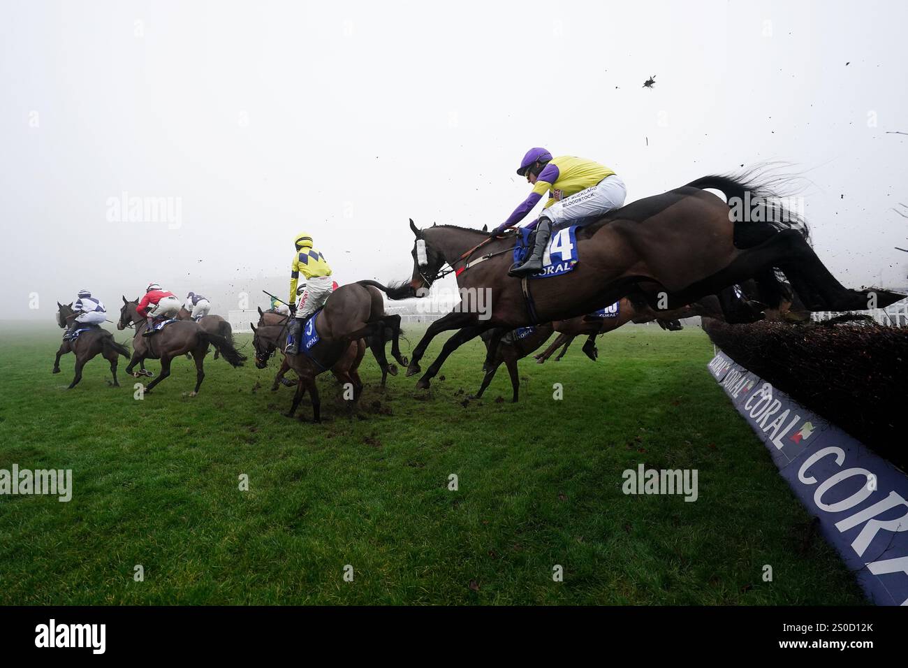 Runners and riders compete in the Welsh Grand National Handicap Chase