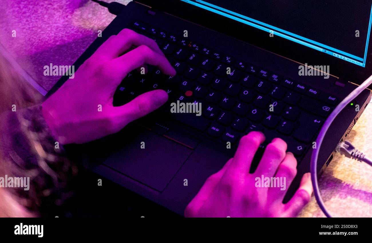 Hamburg, Germany. 27th Dec, 2024. A participant at the Chaos Computer ...