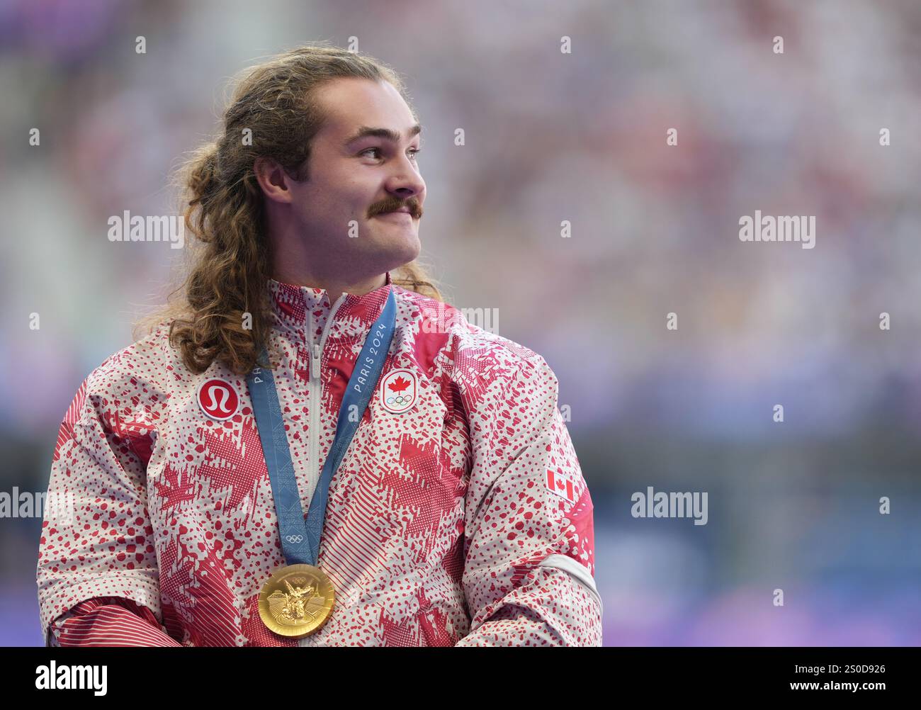 Ethan Katzberg, of Nanaimo, B.C., receives his gold medal in the men's