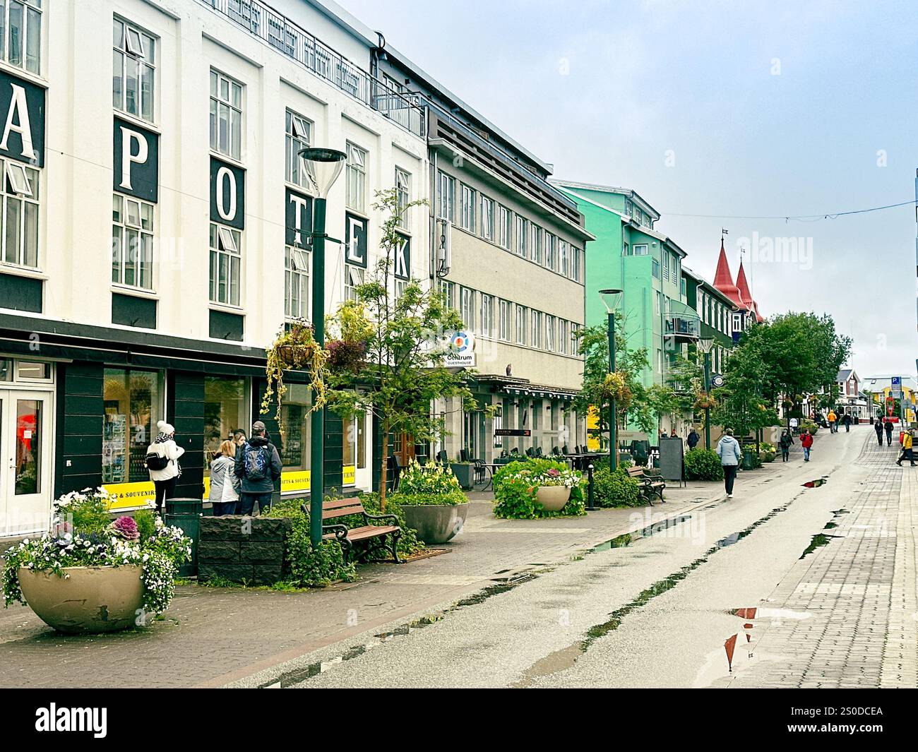 Akureyri, Iceland - 24 August 2024: People walking down the main street of Akureyri, which is the capital of the north of the island of Iceland - Smartphone Captured Stock Image