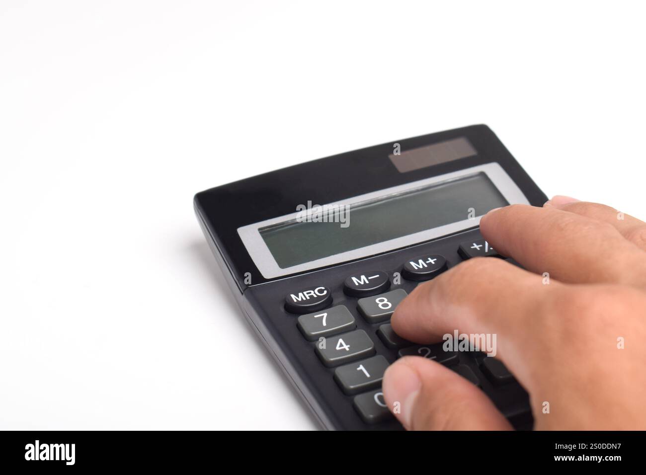 Hands holding and using a calculator isolated on a white background Stock Photo