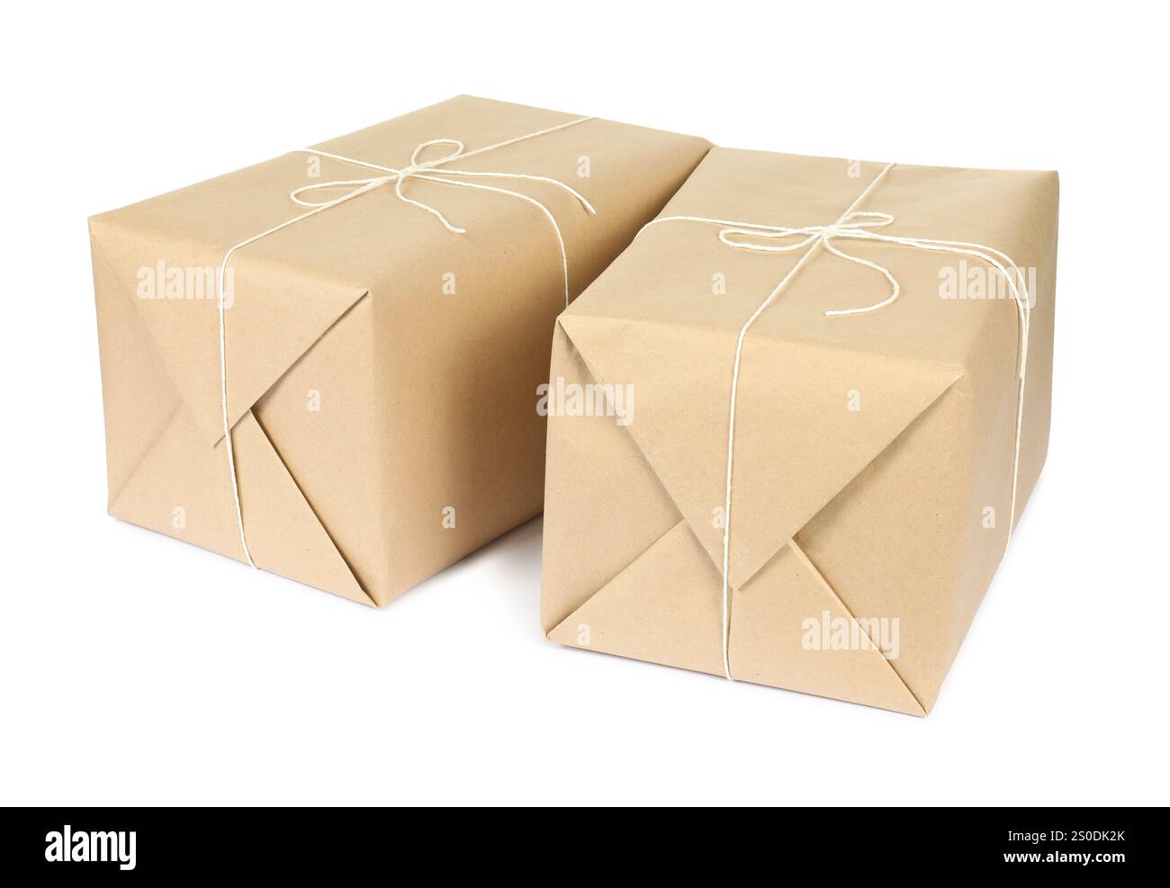 Parcel boxes wrapped in paper isolated on white Stock Photo - Alamy