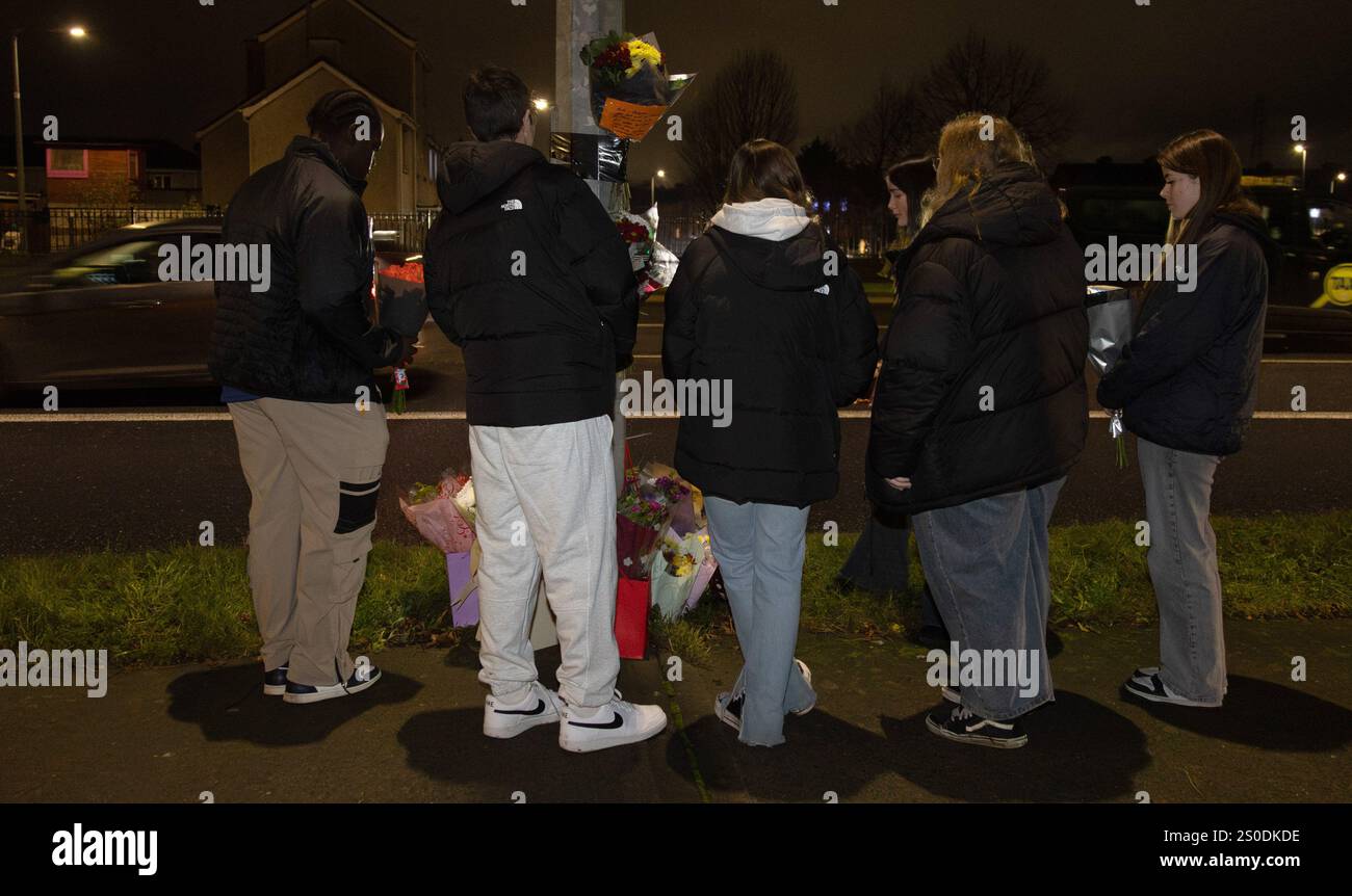 People attend a vigil at the scene on Blanchardstown Road North, west Dublin, where two pedestrians were killed in a hit-and-run incident on Boxing Day. The couple have been named locally as Anthony Hogg and his wife Georgina Hogg Moore. A man in his 40s has been arrested after the incident at about 5.45pm on Thursday. Picture date: Friday December 27, 2024. Stock Photo