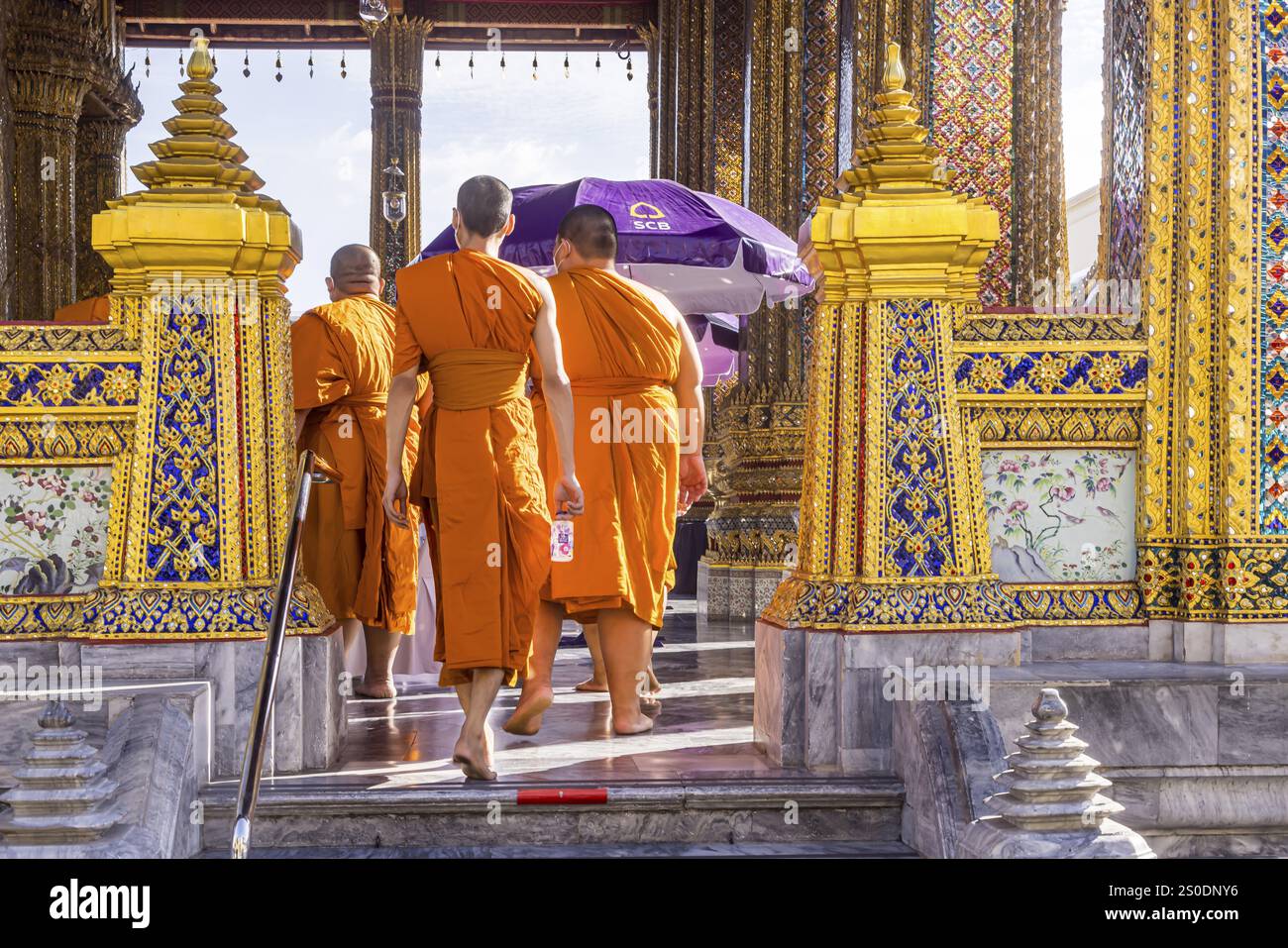 Wat Phra Kaeo temple, royal palace. Royal chapel with Buddhist monks and novices. Bangkok, Thailand, Asia Stock Photo