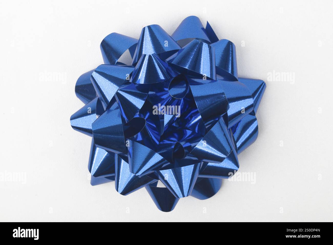 Top view of decorative blue gift bow against white background Stock Photo