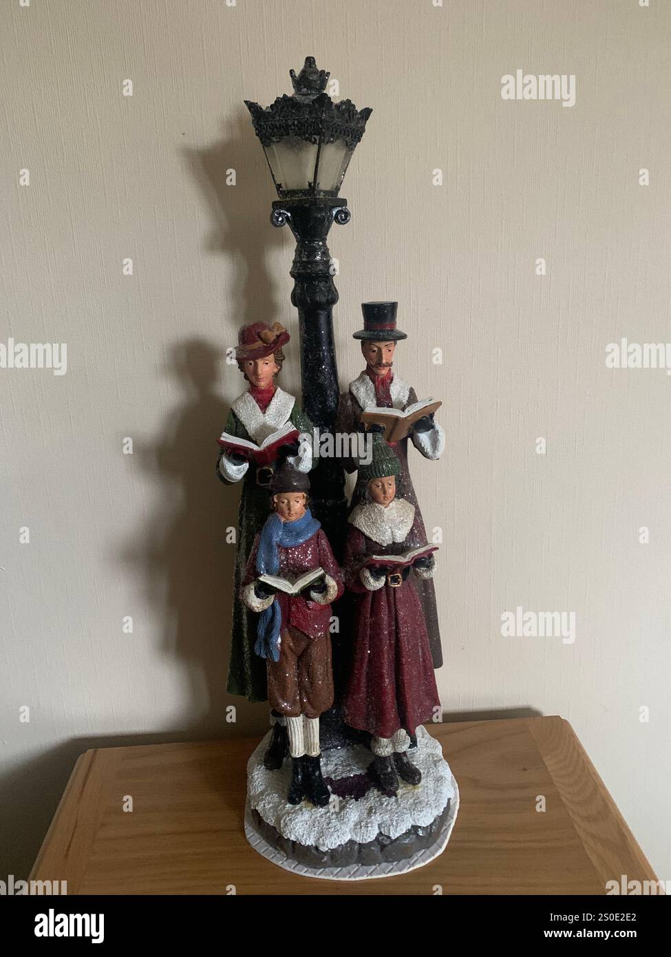 Christmas  lights lamp lamp post singing books song song sang snow weather time place home happy people quare old fashioned Victorian light - Smartphone Captured Stock Image