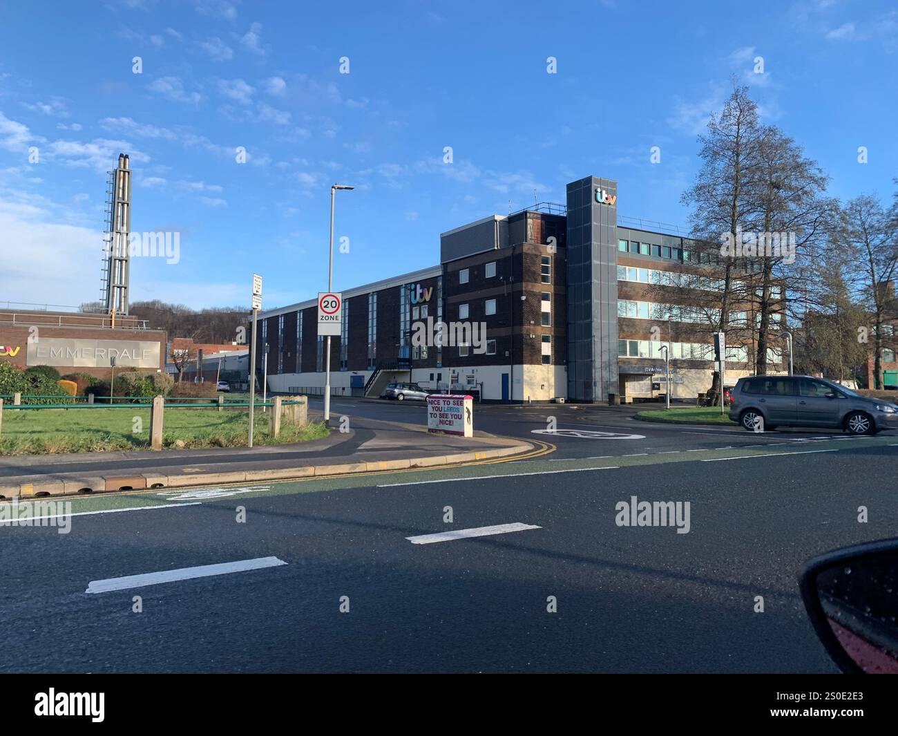 ITV Leeds building television centre road work sign aerial broadcasting place news work report reporters program programs events casting time weather - Smartphone Captured Stock Image