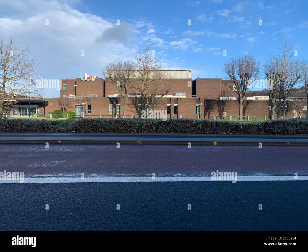 Guiseley North Yorkshire houses trees place town village countryside place sky weather Winter Christmas day place bleak clouds England old types - Smartphone Captured Stock Image