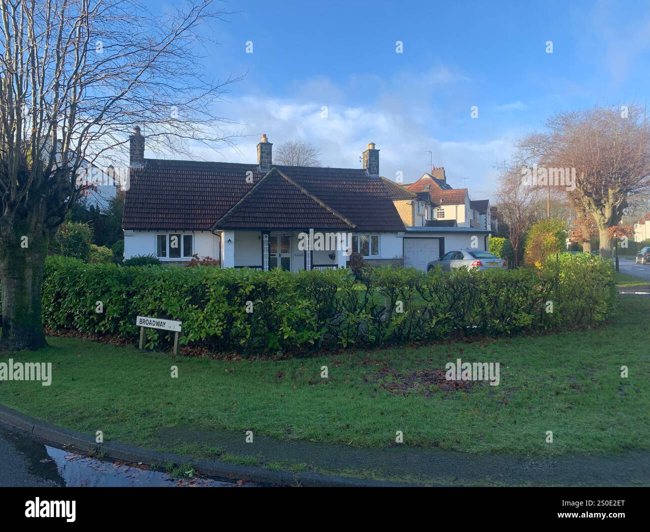 Guiseley North Yorkshire houses trees place town village countryside place sky weather Winter Christmas day place bleak clouds England old types - Smartphone Captured Stock Image