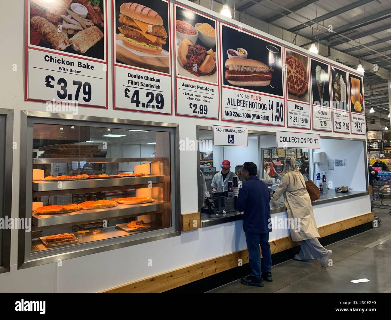 Costco retail shop wholesale place food cooked cooking sell buy North Yorkshire food cooked cooking Leeds sign cost money picture people watching - Smartphone Captured Stock Image