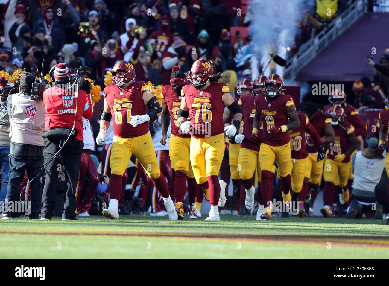 The Washington Commanders are introduced before an NFL football game