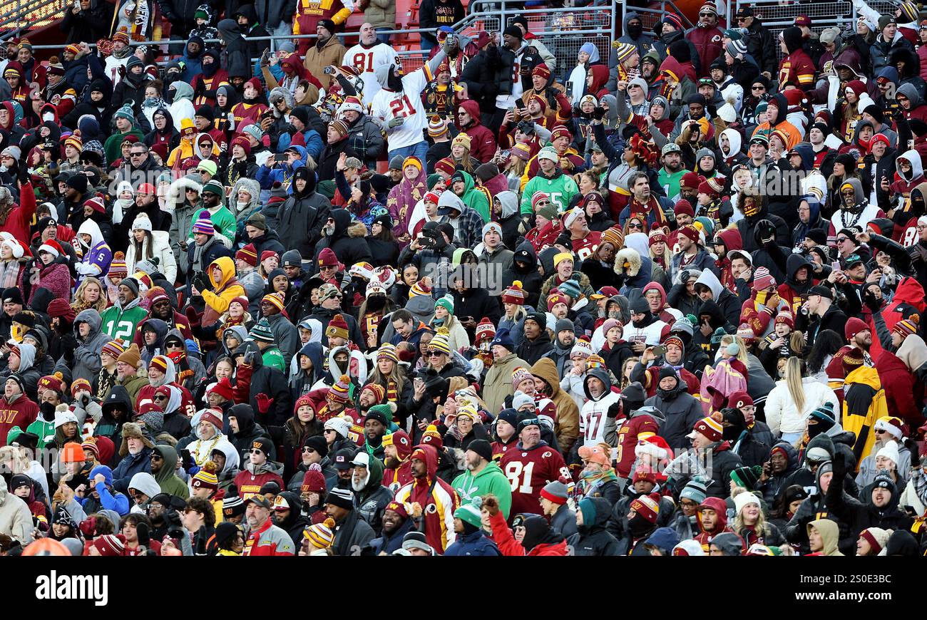 Washington Commanders fans celebrate during an NFL football game