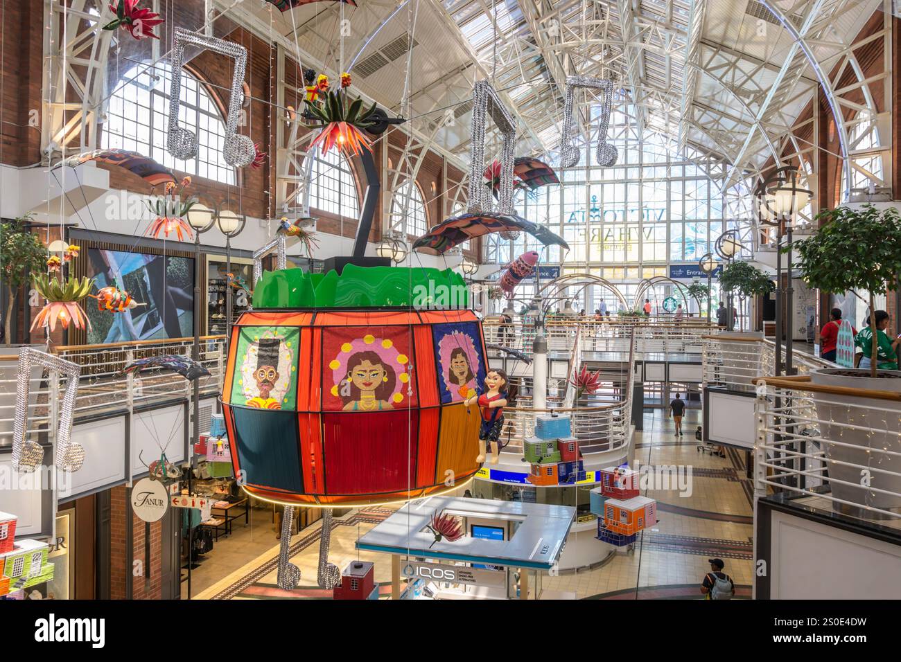 Large colourful Christmas decoration display inside the Victoria Wharf shopping centre at the V&A Waterfront in Cape Town, South Africa on 5 December Stock Photo