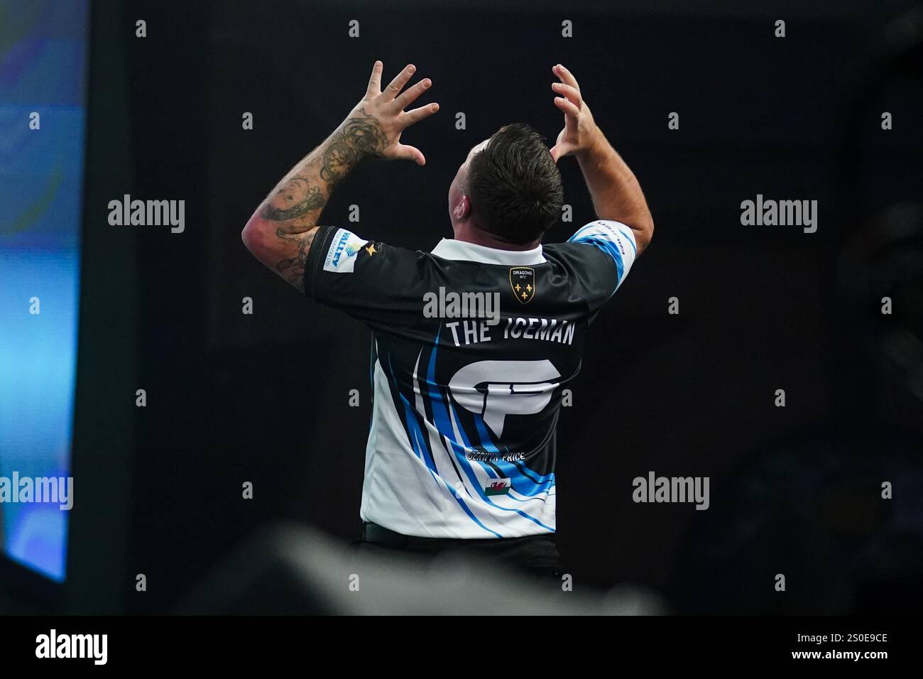 Gerwyn Price celebrating winning during the 3rd round match between