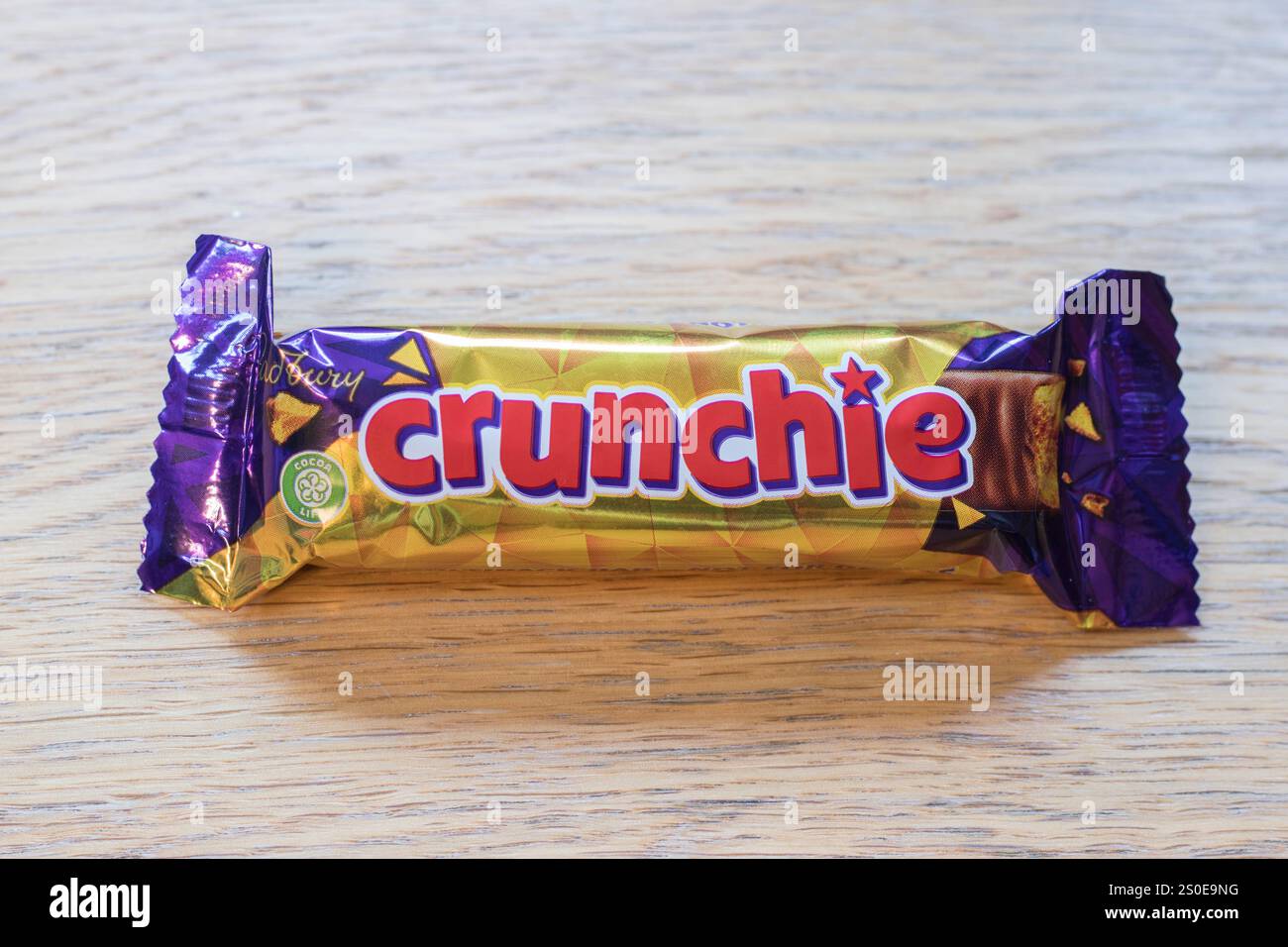 Cadbury crunchie chocolate bar snack on a table Stock Photo