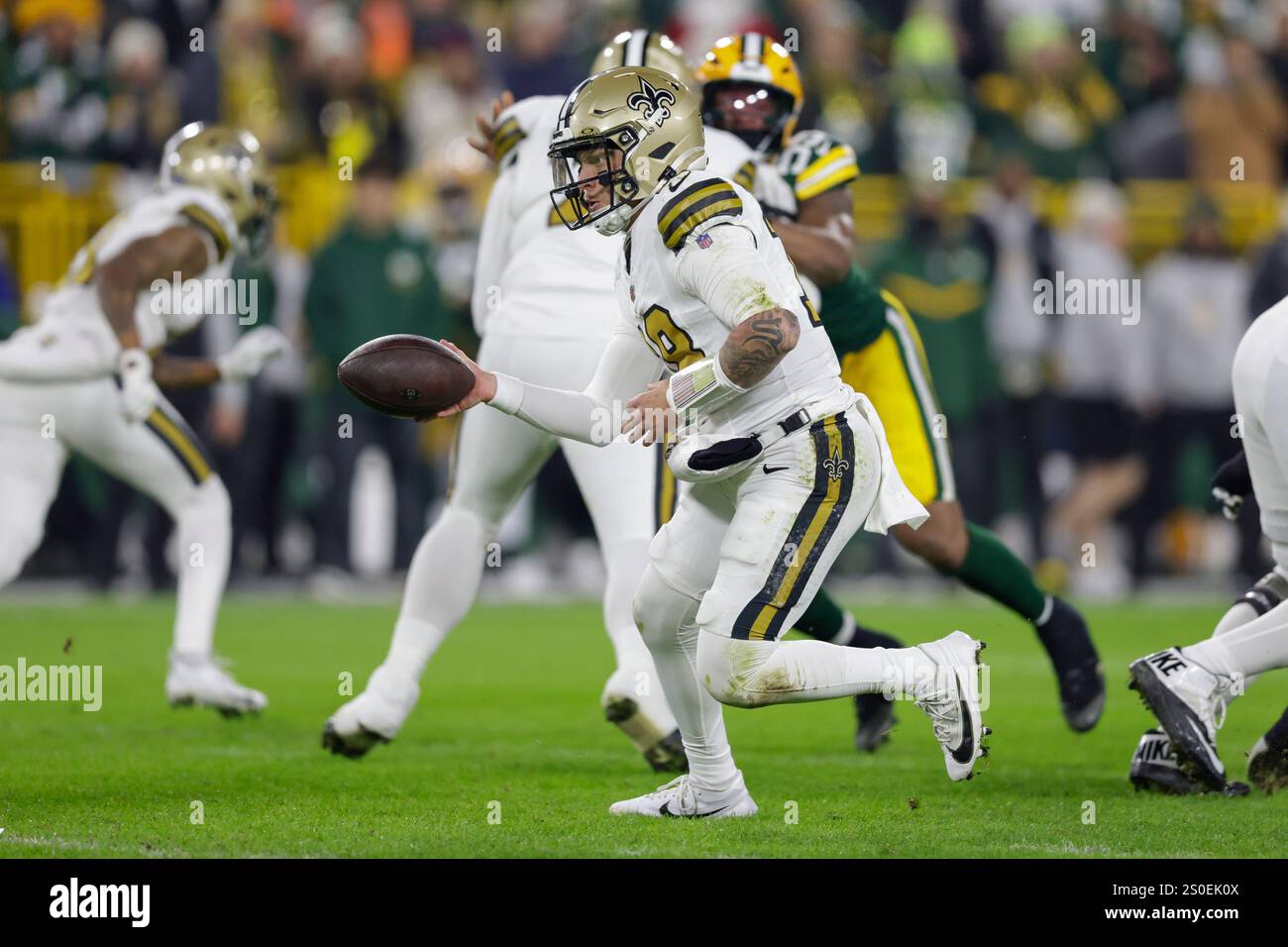 New Orleans Saints quarterback Spencer Rattler (18) hands the ball off