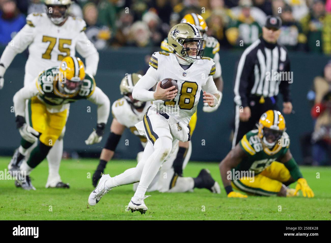 New Orleans Saints quarterback Spencer Rattler (18) scrambles out of