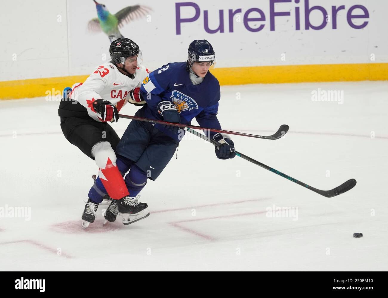 Canada forward Tanner Howe (23) collides with Finland defenceman Mitja