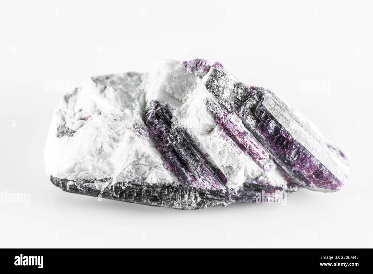 A Kyanite rock with a white and purple color. The rock is rough and has ...