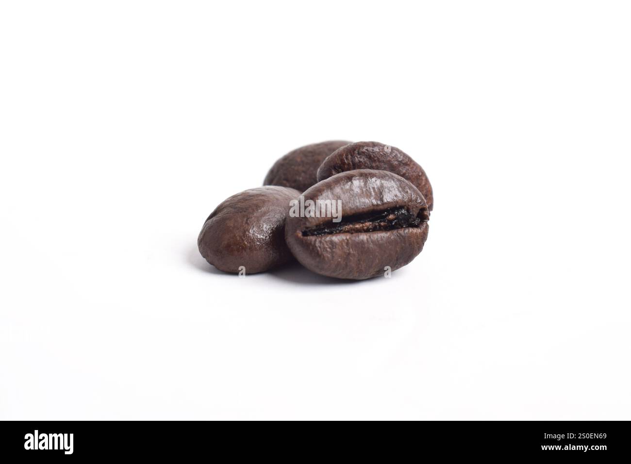 Roasted coffee beans isolated on white background Stock Photo - Alamy