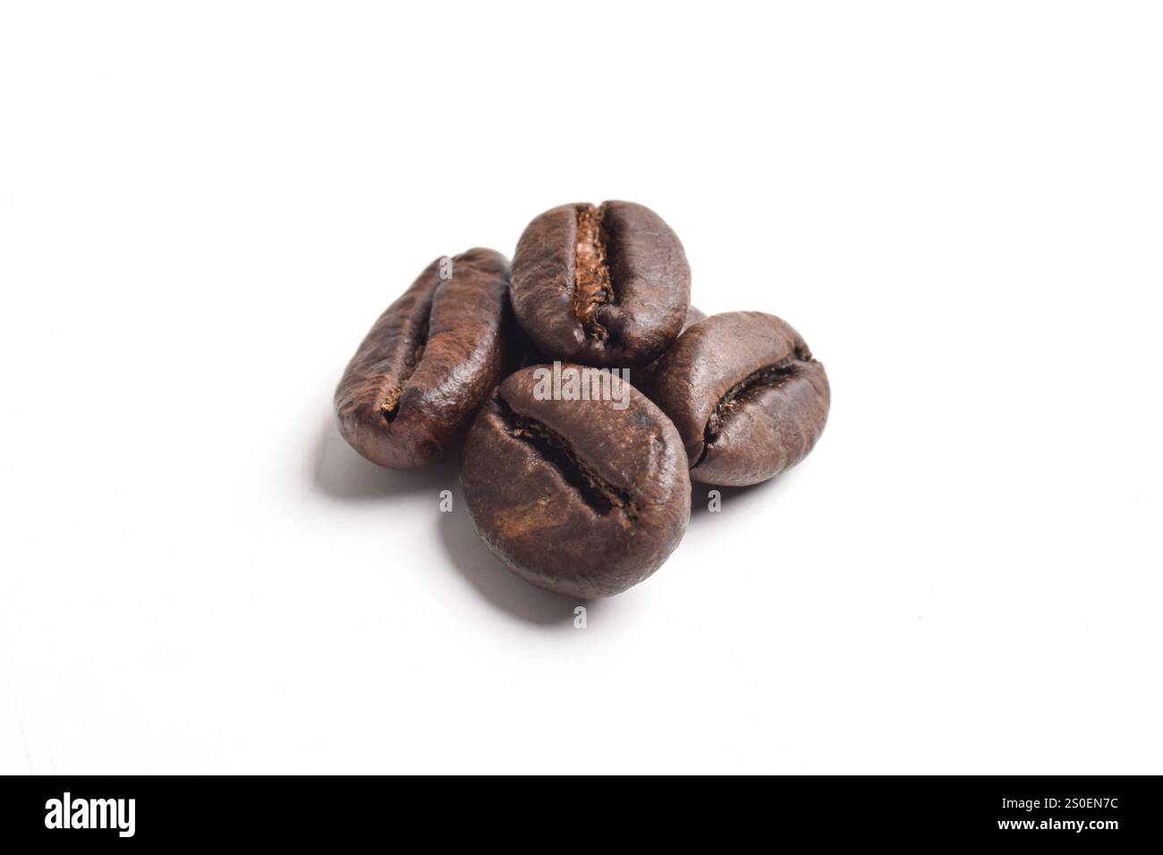 Roasted coffee beans isolated on white background Stock Photo - Alamy