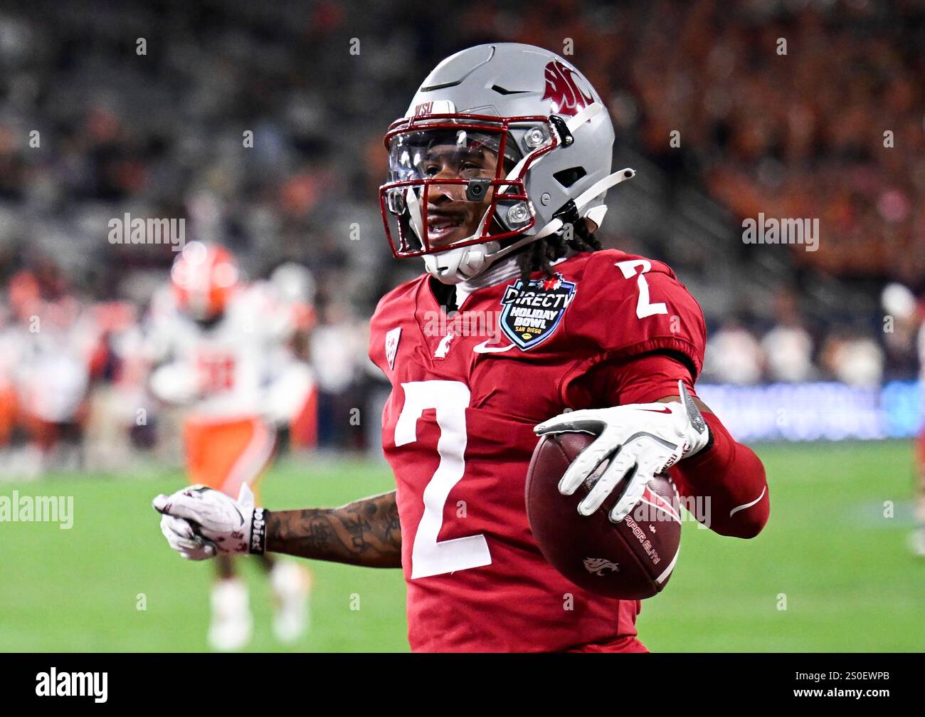 Washington State wide receiver Kyle Williams (2) celebrates after