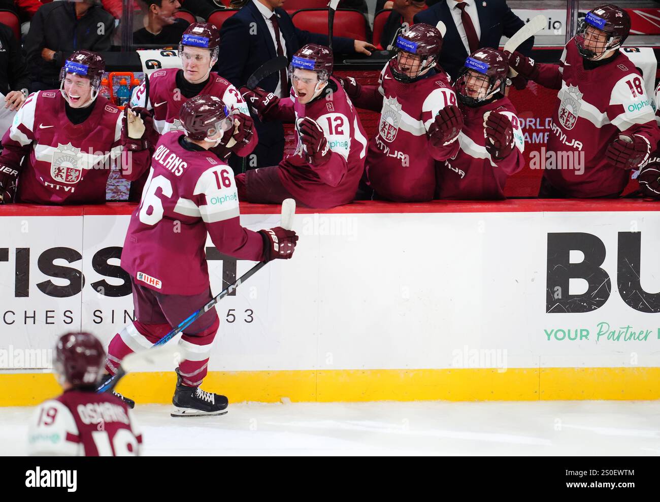 Latvia's Peteris Bulans (16) celebrates his goal against Canada during