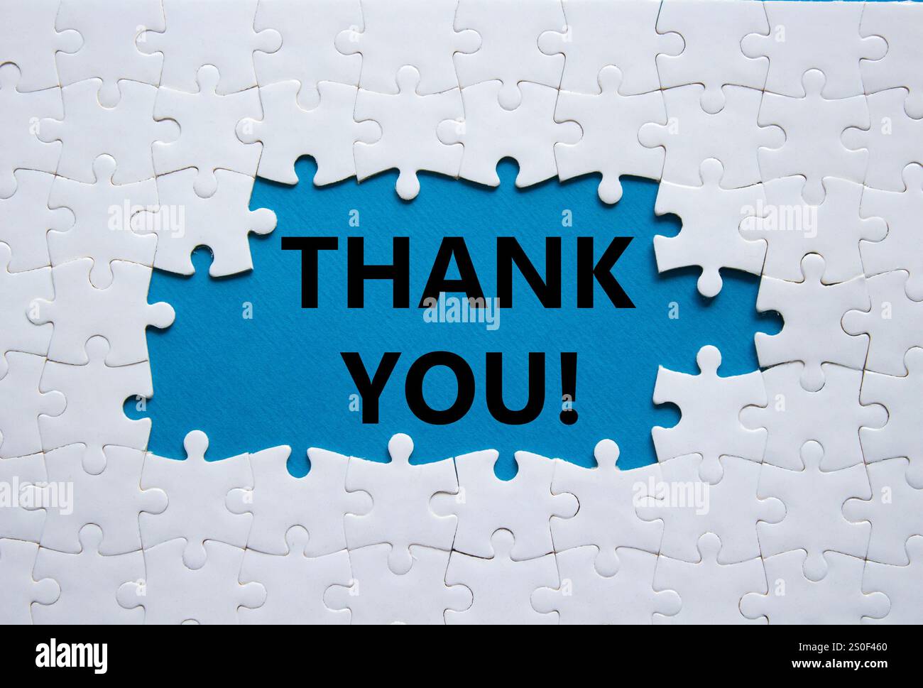 Thank you symbol. White puzzle with words Thank you. Beautiful blue ...