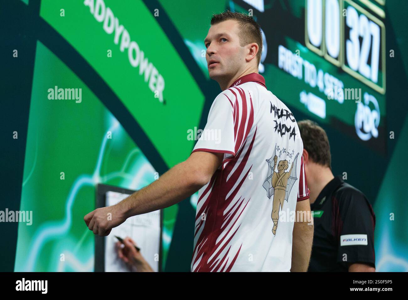 Madars Razma during the 3rd round match between Stephen Bunting and