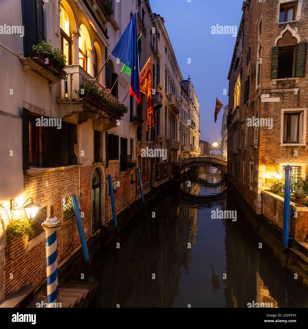 Venetian canal in the evening. Reflection of the medieval city in the ...