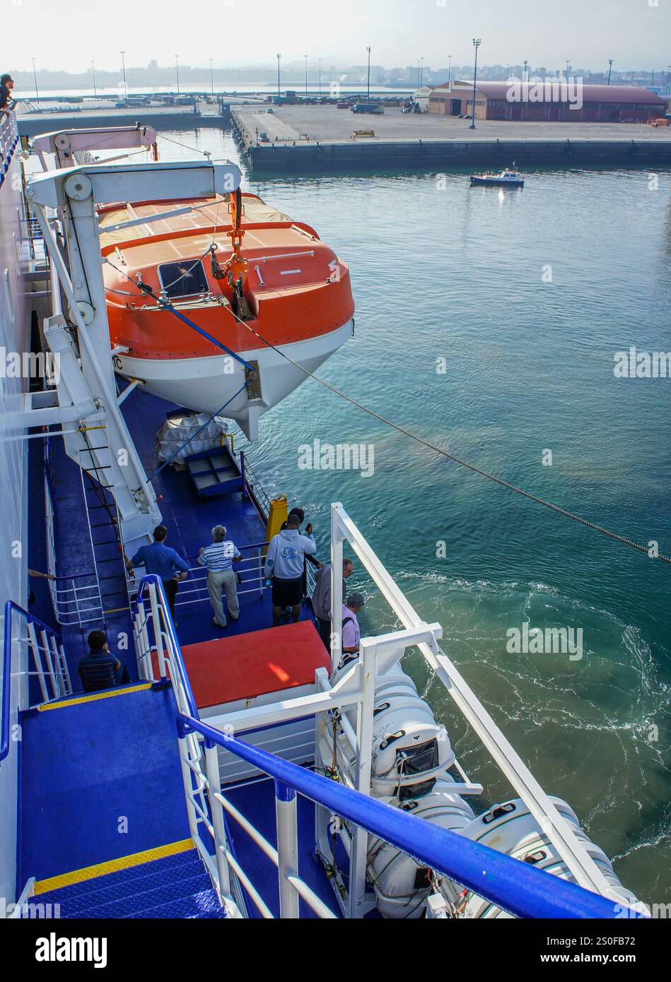 FILE PICS: At Sea, St Nazaire-Gijon. Dec 28, 2024: Lifeboat, lifejackets box & inflatable life raft container on board ferry NORMAN ATLANTIC. Look back at this sadly infamous ship that burned exactly 10 years ago, on the night of December 27-28, 2014 off Albanian coast causing death of 30 people (19 still missing) including 2 rescuers, the injury of 64 passengers/crew. Owned by Italian ferries line Visemar, chartered by Greek Anek Lines, the modern ship, built 5 years earlier, caught fire in garage due to trucks being left on during navigation, which is...Credit: KEVIN IZORCE/Alamy Live News Stock Photo