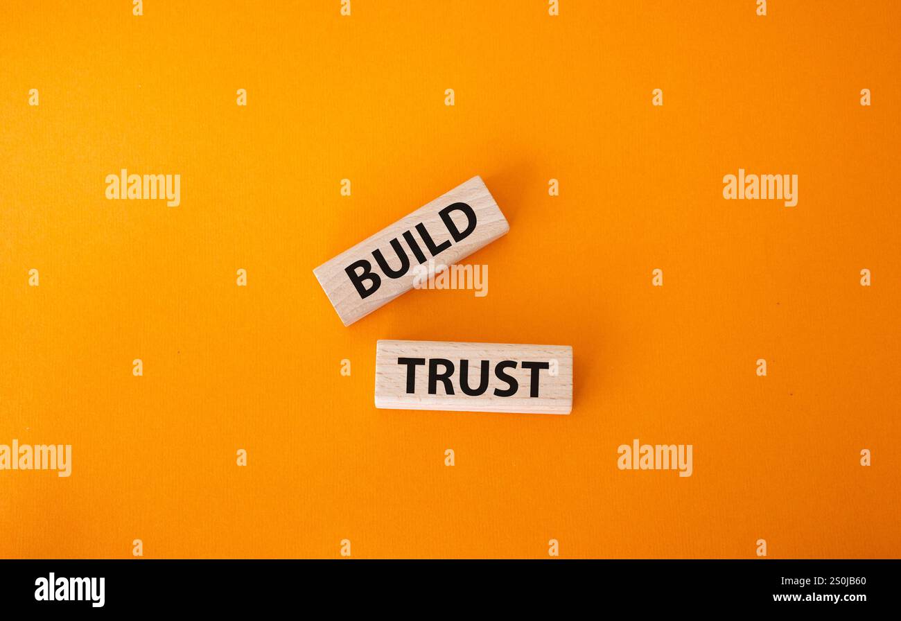 Build trust symbol. Wooden blocks with words Build trust. Beautiful ...