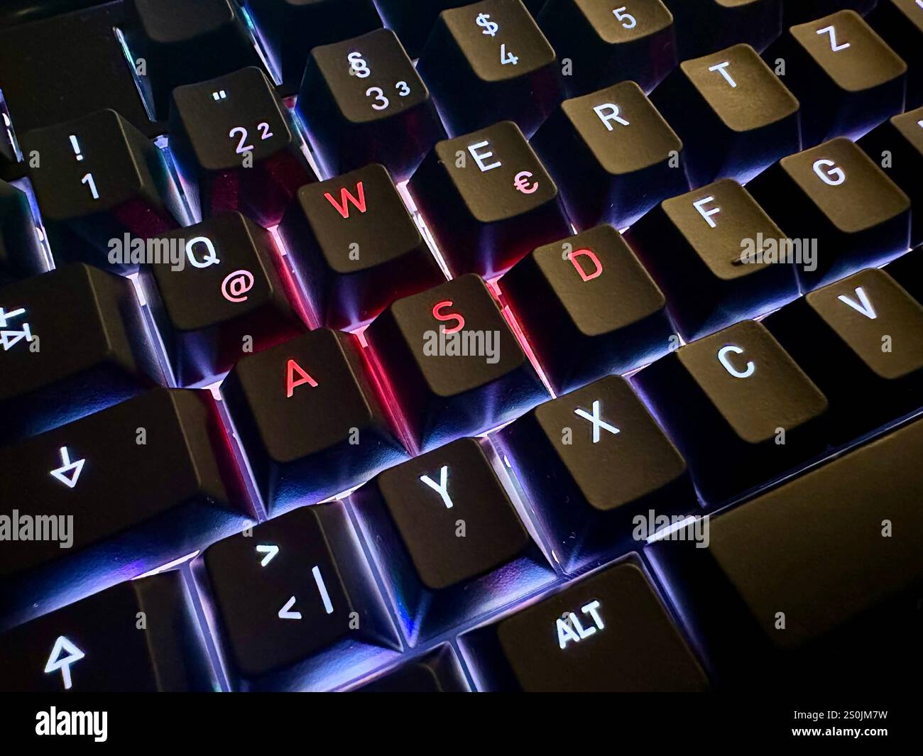 The letters WASD highlighted on an LED keyboard, concept: gaming - Smartphone Captured Stock Image
