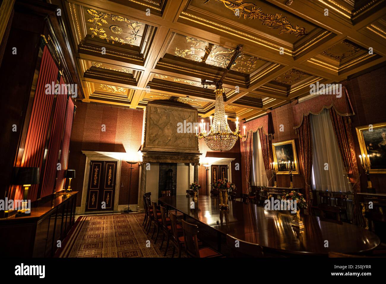 Dining Hall with Gold-Adorned Ceiling in Amsterdam Royal Palace - Netherlands Stock Photo