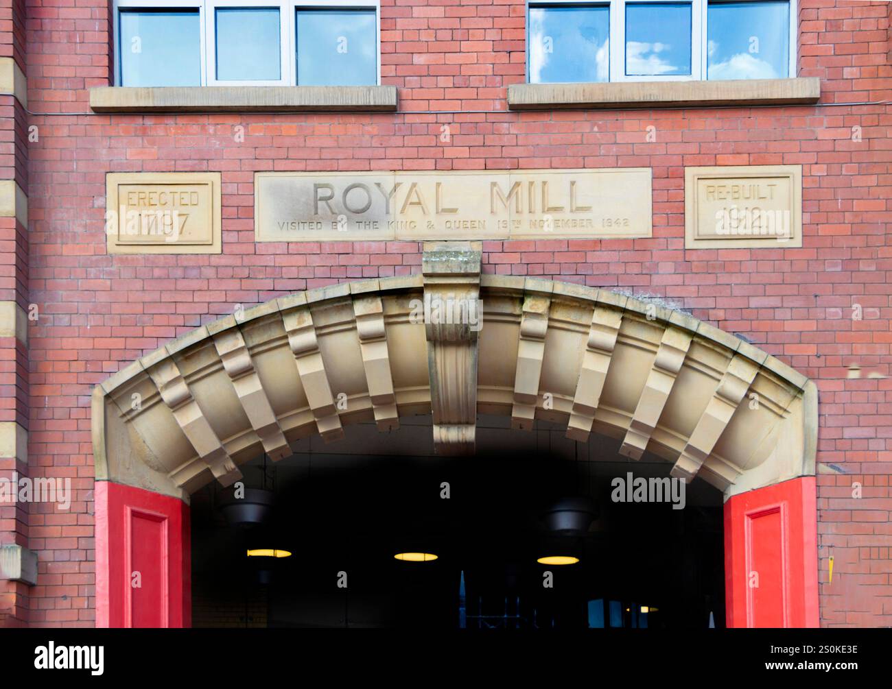 Brigg Royd Mill Historic brick facade of the Royal Mill featuring an arched entrance ...