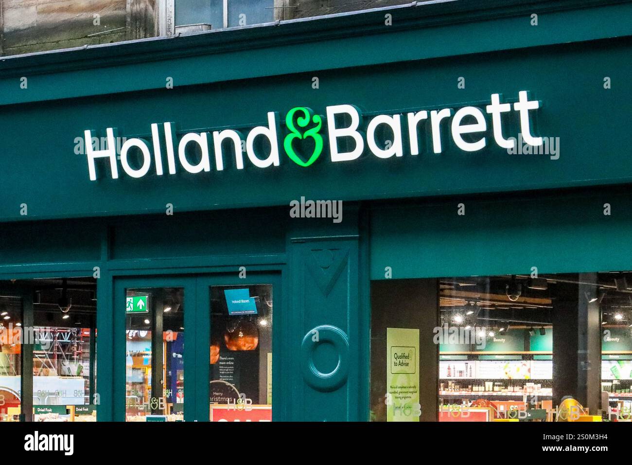 Named sign of Holland and Barrett, shop selling health food, Glasgow, Scotland, UK Stock Photo