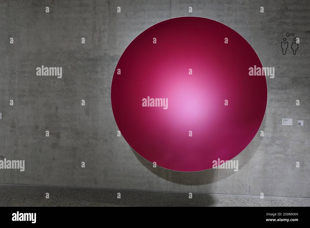 Wuerth Museum 2, Red ball in front of concrete wall in minimalist art installation, Carmen Wuerth Forum, Gaisbach, Kuenzelsau, Baden-Wuerttemberg, Ger Stock Photo