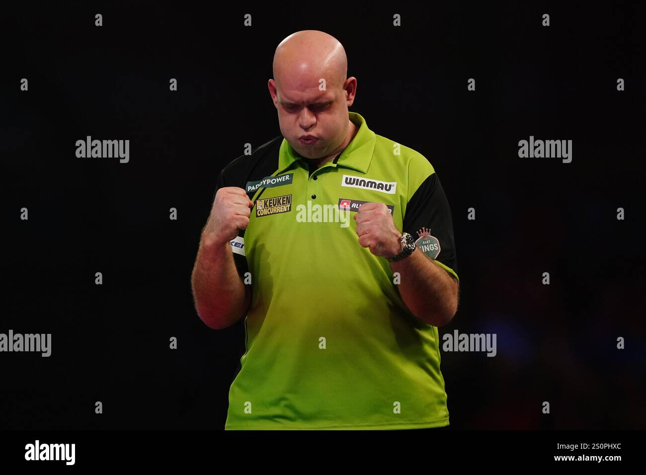 Michael van Gerwen celebrates after winning his third round match