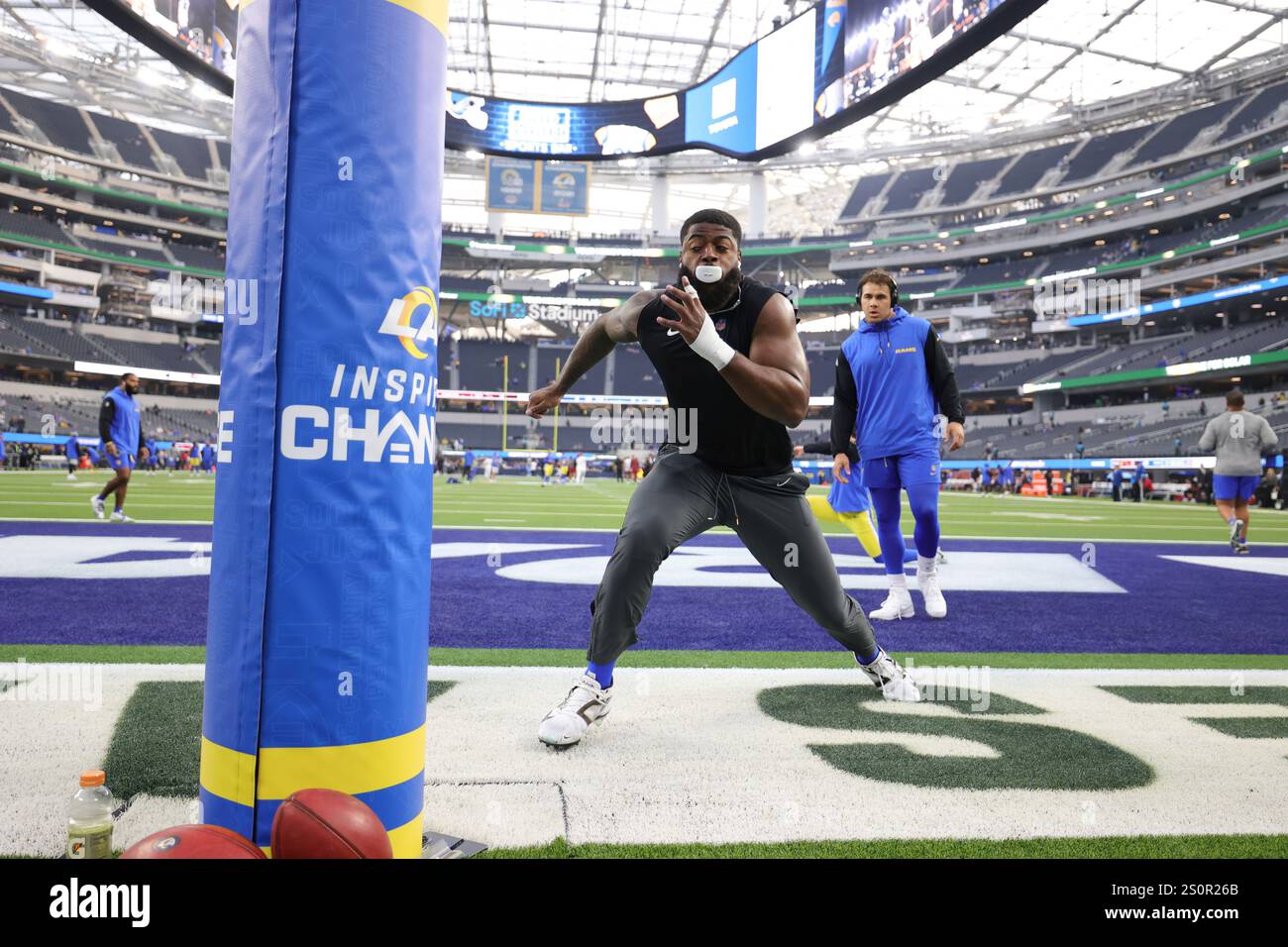 Los Angeles Rams linebacker Jared Verse warms up before an NFL football ...