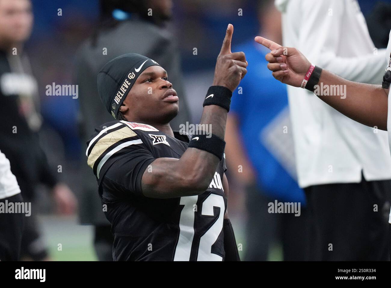 Colorado wide receiver Travis Hunter (12) warms up for the Alamo Bowl