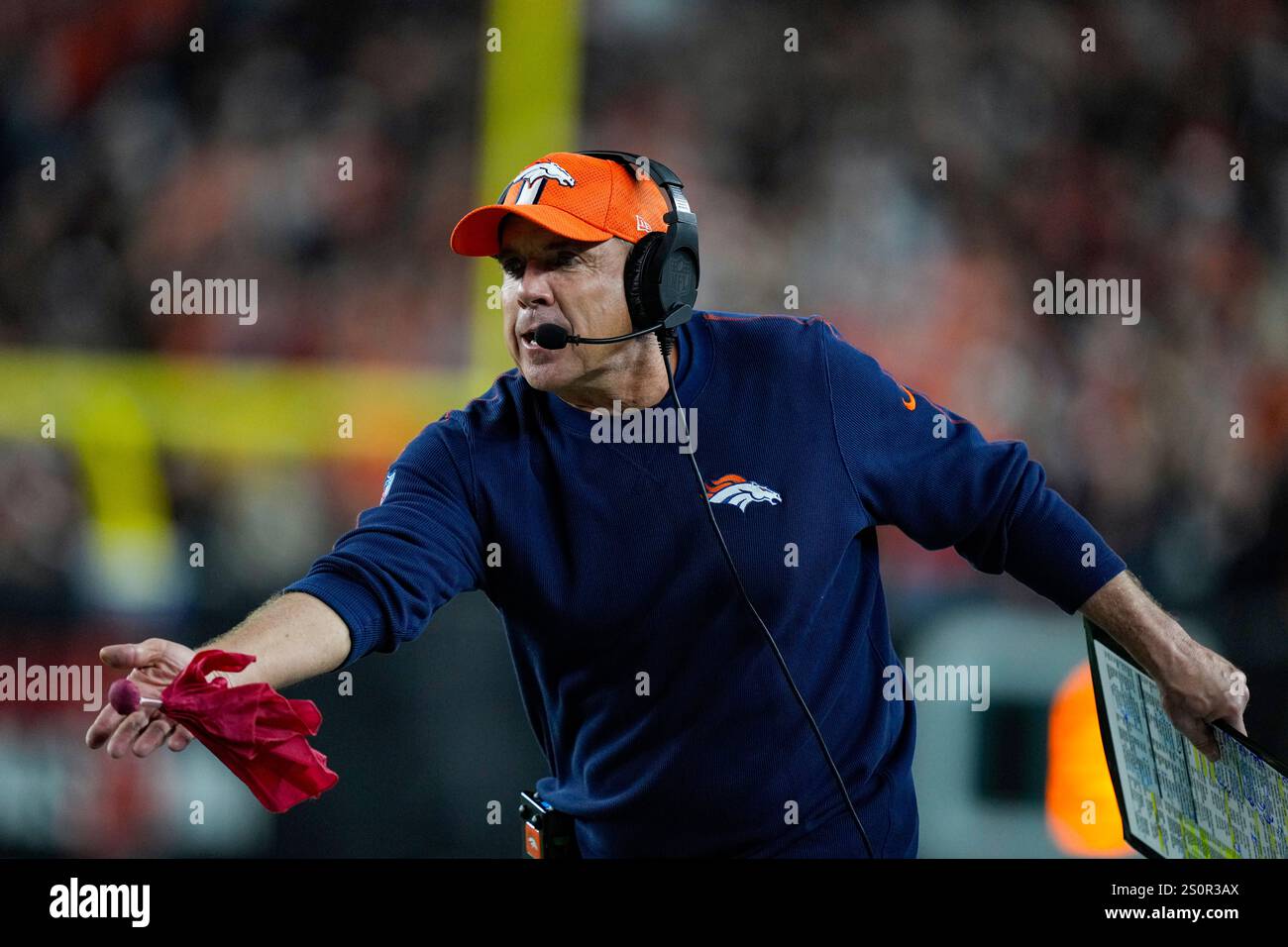 Denver Broncos head coach Sean Payton challenges a call during the