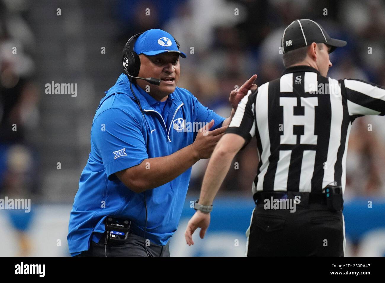 BYU head coach Kalani Sitake, left, argues a call during the second