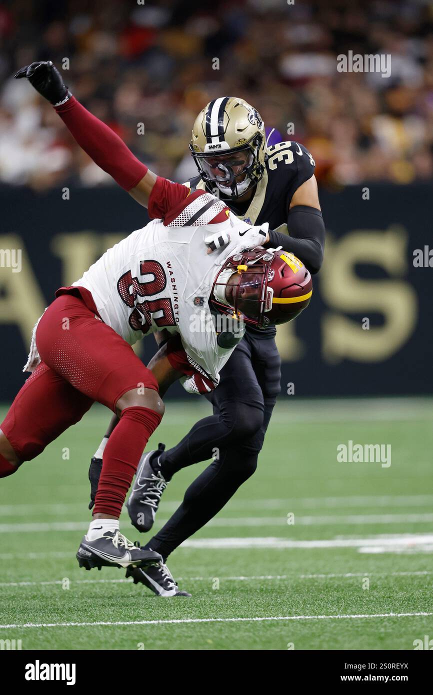 Tyler Rico Uaf Washington Commanders safety Percy Butler (35) is defended by New ...